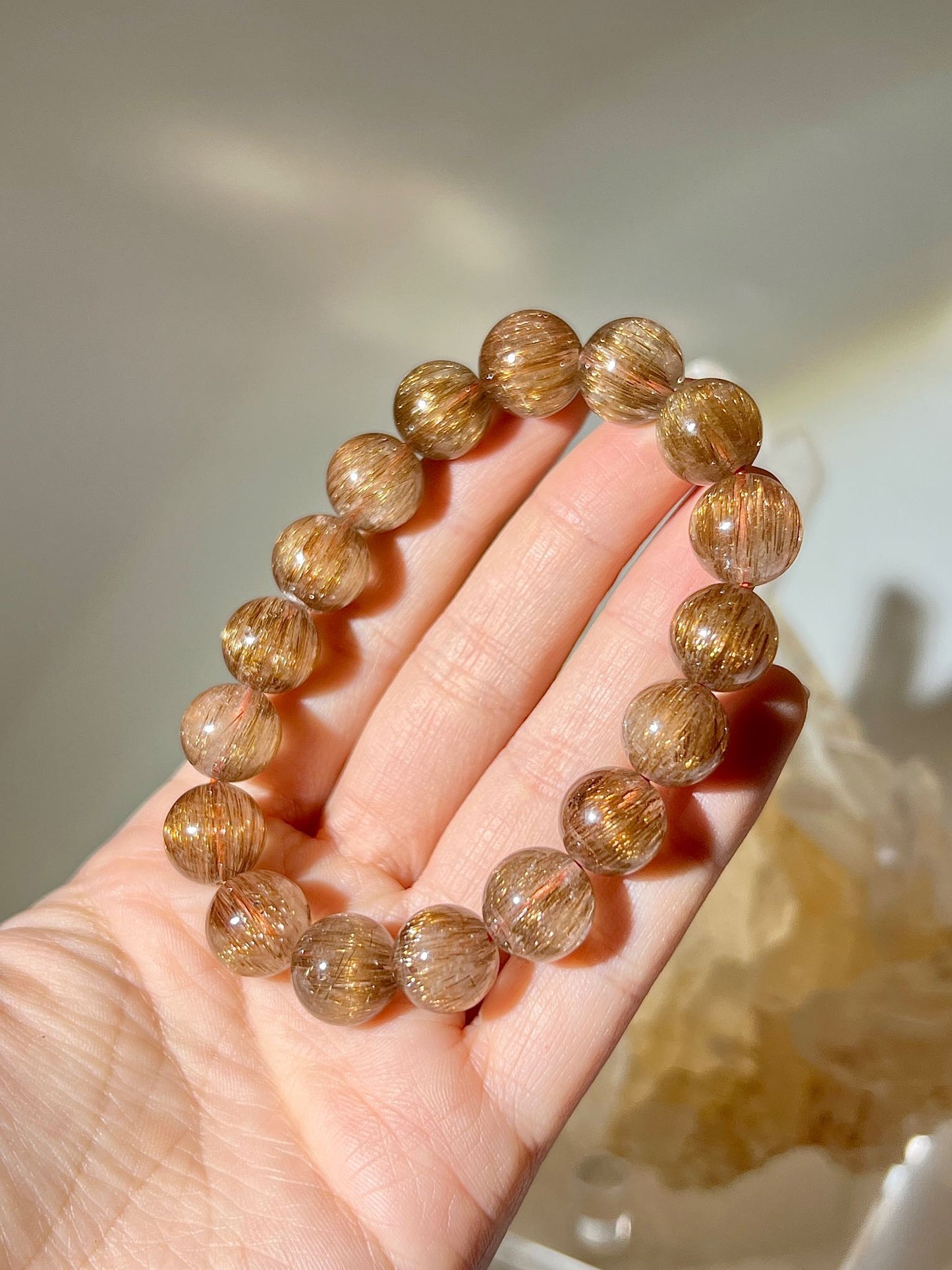 什麼是銅髮晶 髮晶有什麼功效 銅髮晶 紅銅髮 紅髮晶 rutilated quartz 南無水晶 貓眼髮晶 招財