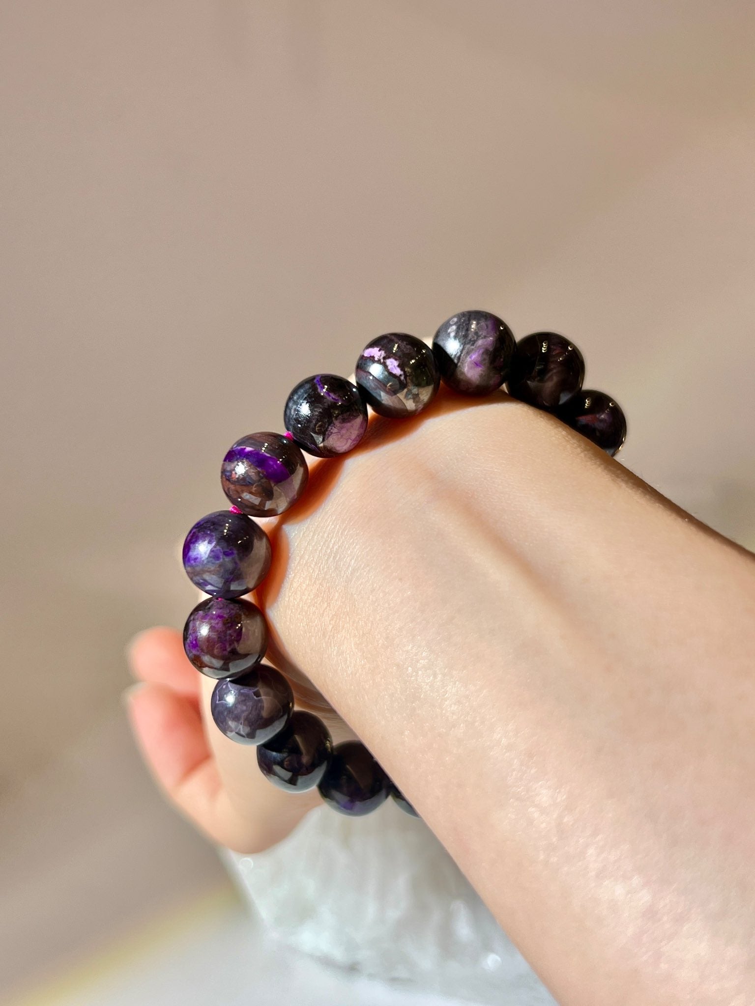 Sugilite bracelet 11MM with rich purple and black mineral patterns